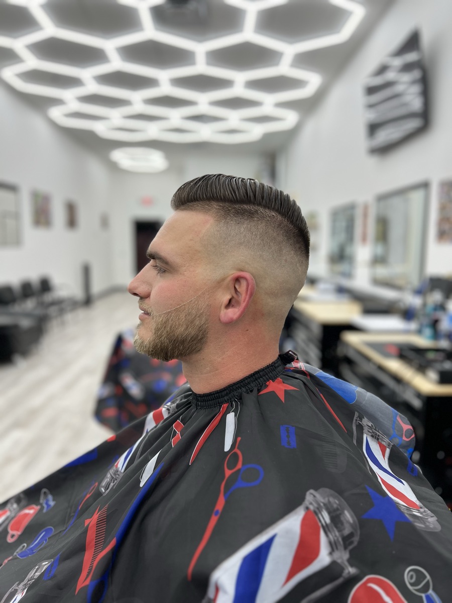 Classic pompadour haircut with a smooth fade at Luke's Barber Shop